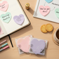 Transparent pearlescent sticky notes in the shape of a heart