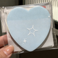 Transparent pearlescent sticky notes in the shape of a heart